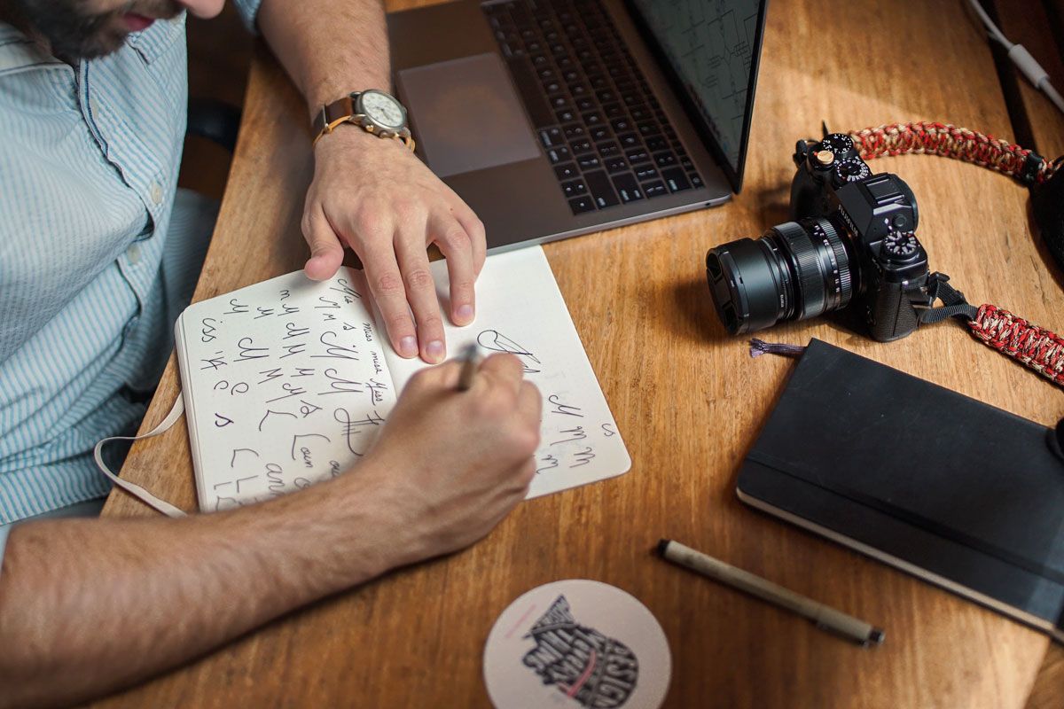 Man Sitting and Sketching Man Sitting and Sketching